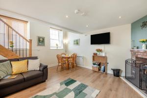 a living room with a couch and a table at 1 Bed in Berwick-upon-Tweed oc-c32028 in Kyloe