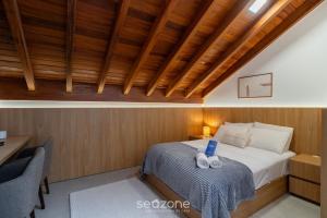 a bedroom with a bed with a blue laptop on it at Modern studio in Downtown Floripa CMA0101 in Florianópolis