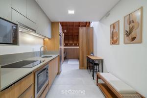 a kitchen with a sink and a counter at Modern studio in Downtown Floripa CMA0101 in Florianópolis