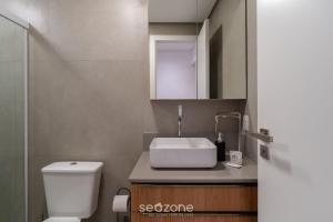 a bathroom with a sink and a toilet at Modern studio in Downtown Floripa CMA0101 in Florianópolis