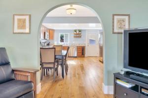 an open kitchen and dining room with a table and chairs at Home Squared-Downtown with Fire Pit in Paso Robles