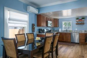 a kitchen with a table and chairs and a counter at Home Squared-Downtown with Fire Pit in Paso Robles