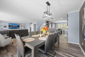 a dining room and living room with a table and chairs at 1130 Mockingbird St in Brighton