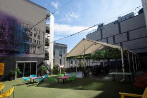 a group of tables and chairs in a courtyard at HOTEL10 in Montreal