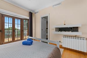 a bedroom with a bed and a fireplace at Villa Picasso Marbella in Marbella +68 photos