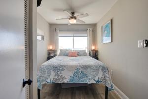a bedroom with a bed and a ceiling fan at Beach, Pool & Ocean View! North Myrtle Beach Condo in Myrtle Beach +27 photos