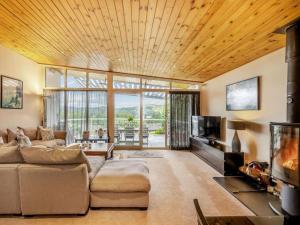 a living room with a couch and a tv at 4 Bed in Windermere oc-95682 in Winster
