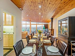 a dining room with a long table and chairs at 4 Bed in Windermere oc-95682 in Winster