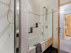 a bathroom with a shower and a staircase at 4 Bed in Windermere oc-95682 in Winster +33 photos