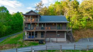 a house sitting on the side of a road at Afterglow by Ghosal Luxury Lodging in Sevierville