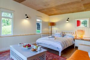 a bedroom with a bed and a table in it at 1 Bed in South Hams oc-g31078 in Kingston
