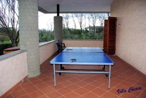 a blue ping pong table on a patio at Villa Chiara in Bracciano