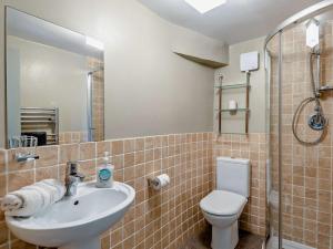 a bathroom with a sink and a toilet and a shower at 4 Bed in Hope Valley oc-pk939 in Curbar +9 photos