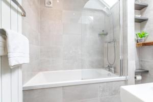 a bathroom with a shower and a bath tub at 2 Bed in Baslow oc-h32721 in Baslow +13 photos