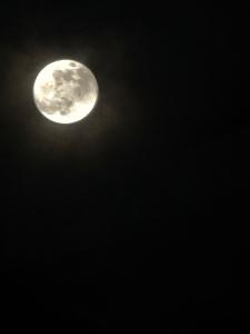 a moon in the sky at night at B&B Sud Est in Carmiano
