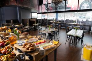 a table filled with lots of different types of food at HOTEL10 in Montreal