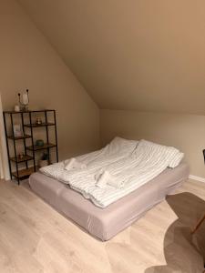 a white bed in a room with at Central apartment in Svolvær in Svolvær +1 photo