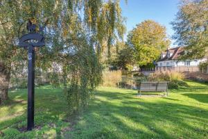a park with a bench and a street light in the grass at 2 Bed in Ashley oc-c32637 in Ashley +7 photos