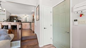 a kitchen with a door leading into a living room at Honey Hole 3 Well Dock in Camdenton +37 photos