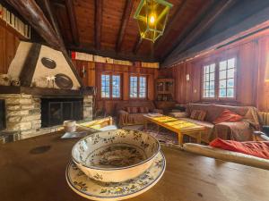 a living room with a large bowl on a table at Chalet Le Zirizui - Authentique refuge alpin avec vue imprenable in Liddes