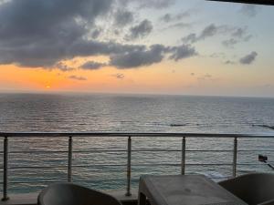 a view of the ocean at sunset from a cruise ship at Apartment 18 Maspero in Alexandria