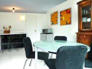 a dining room with a table and chairs at Apartment Perle-Lollipop by Interhome in Bullay