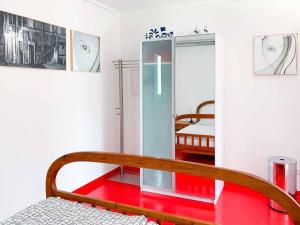 a room with a wooden bench and a bedroom at Apartment Perle-Lollipop by Interhome in Bullay