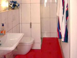 a bathroom with a white toilet and a sink at Apartment Perle-Lollipop by Interhome in Bullay +29 photos