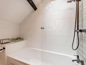 a bathroom with a shower and a bath tub at 2 Bed in Ambleside oc-sz500 in Grasmere +12 photos