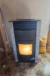 a fireplace is sitting on the floor in a room at Apartment Châlet Hochmatt by Interhome in Im Fang