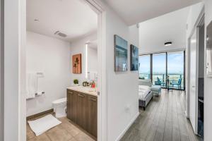 a bathroom with a sink and a toilet and a bedroom at Bay Views Studio in Miami +10 photos