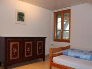 a bedroom with a bed and a window at Apartment Leinacherhof by Interhome in Seeberg