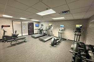 a gym with several treadmills and cardio machines at Preston Suites by IHG in Montgomery