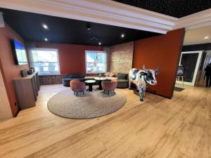 a living room with a statue of a cow in a room at Apartment Hotel Apartment by Interhome in Beatenberg