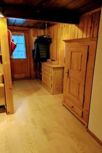 a room with a wooden floor and a wooden door at Apartment Ferienwohnung by Interhome in Blankenburg
