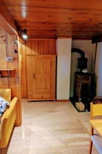 a living room with a woodburning stove in a house at Apartment Ferienwohnung by Interhome in Blankenburg
