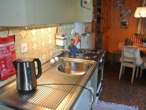 a kitchen with a sink and a counter top at Apartment Huusli by Interhome in Axalp