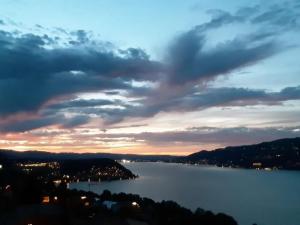 a view of a large body of water at sunset at Apartment Gemütliche Apartment by Interhome in Krattigen