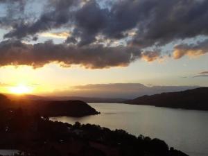 a view of a river at sunset at Apartment Gemütliche Apartment by Interhome in Krattigen