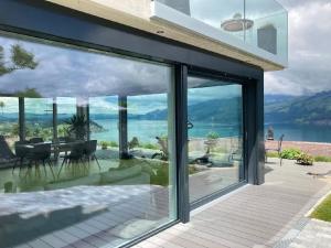 a glass house with a view at Apartment Gemütliche Apartment by Interhome in Krattigen