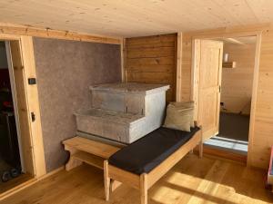 a small room with a bench in a cabin at Apartment Alpenruh by Interhome in Gadmen