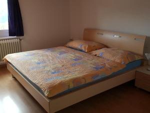 a bed in a small room with at Apartment Alter Konsum by Interhome in Bellwald