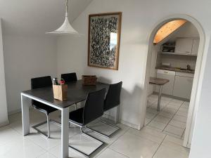 a dining room table and chairs in a kitchen at Apartment Apartment 360 by Interhome in Lucerne