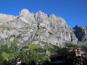 a mountain with a building in front of it at Apartment Royal 22 nahe Klinik- Burgerbad- Einkaufszentrum by Interhome in Leukerbad