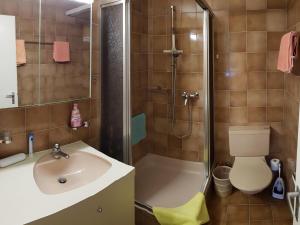 a bathroom with a sink and a shower and a toilet at Apartment Royal 22 nahe Klinik- Burgerbad- Einkaufszentrum by Interhome in Leukerbad