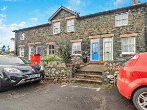 a brick house with a car parked in front of it at 2 Bed in Keswick oc-sz006 in Keswick