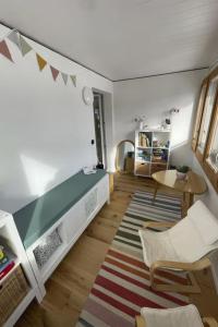 a living room with a bench and a table at Apartment Sunnehöckli by Interhome in Hasliberg