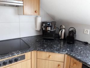 a kitchen counter top with a coffee maker on it at Apartment Gmünde by Interhome in Schüpfheim