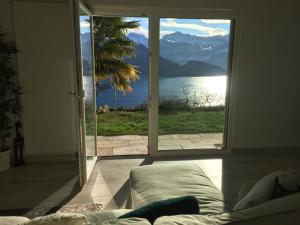 a living room with a view of a large window at Apartment Weggis by Interhome in Weggis