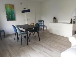 a dining room with a table and chairs at Apartment Weggis by Interhome in Weggis